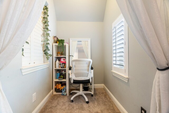 home office with vaulted ceiling, plenty of natural light, baseboards, and carpet floors