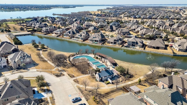 birds eye view of property featuring a residential view and a water view