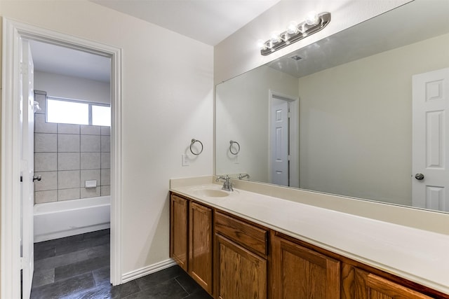 full bath featuring vanity and baseboards