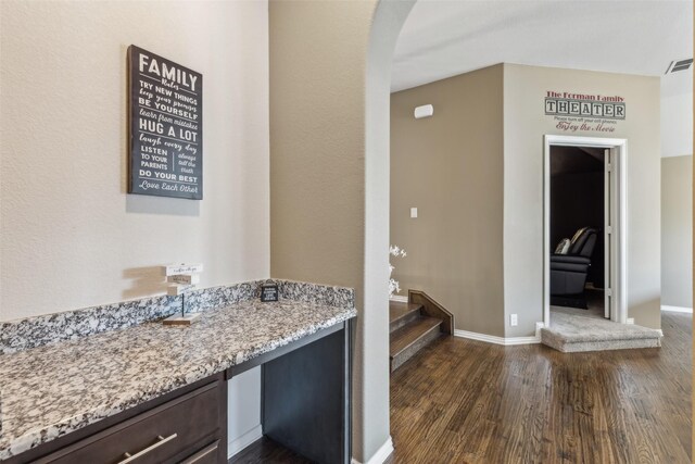 bathroom featuring baseboards and wood finished floors