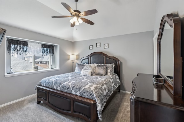 carpeted bedroom with lofted ceiling, baseboards, and ceiling fan