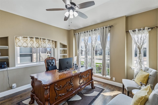 office with baseboards, wood finished floors, and a ceiling fan