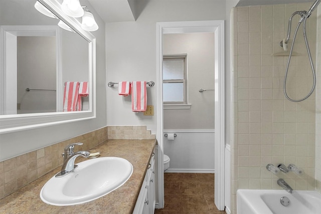 full bathroom featuring tile patterned flooring, toilet, vanity, and bathing tub / shower combination