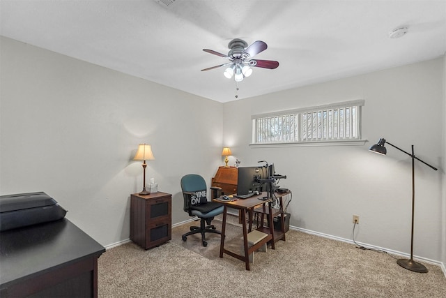 home office with light colored carpet, baseboards, and ceiling fan