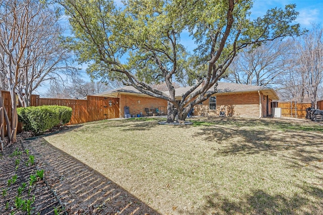 exterior space with a fenced backyard