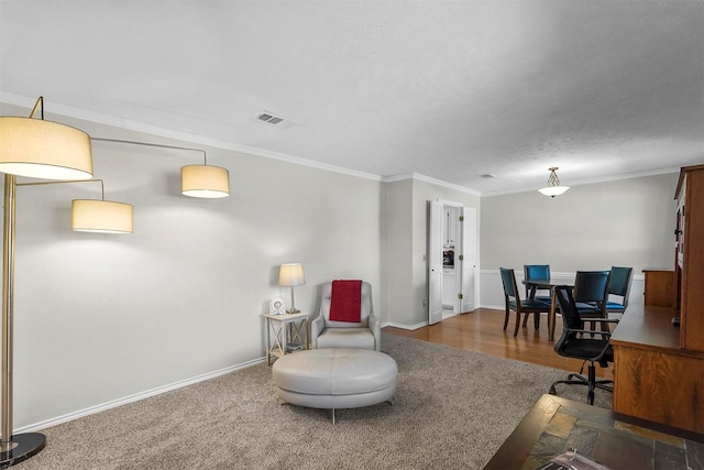 office area with baseboards, visible vents, and ornamental molding