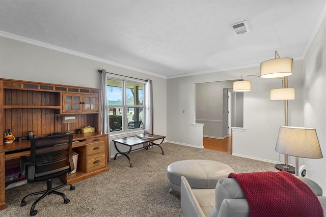 office space featuring visible vents, ornamental molding, baseboards, and carpet floors