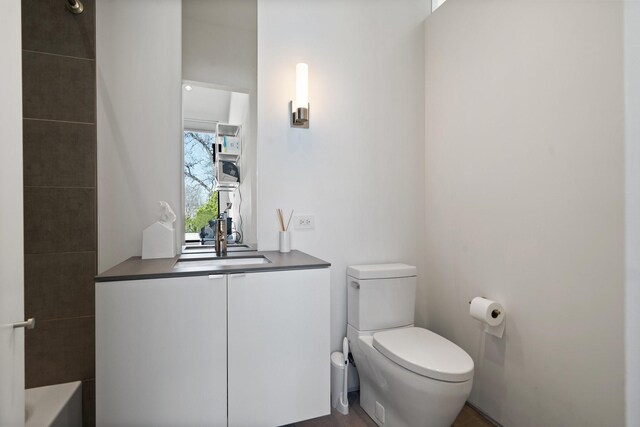 bathroom with vanity and toilet