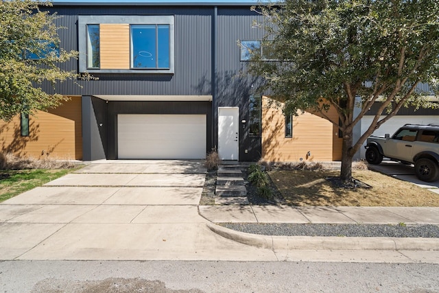 view of front of property with a garage and driveway