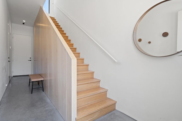 stairs with finished concrete floors