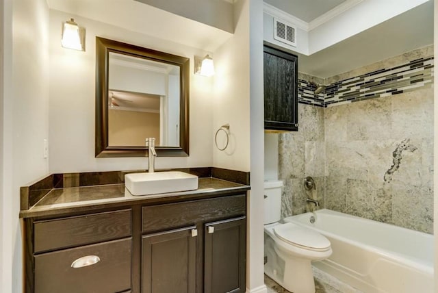 bathroom featuring vanity, visible vents, ornamental molding, shower / bath combination, and toilet