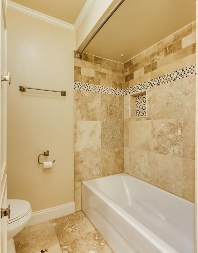 bathroom featuring  shower combination, toilet, baseboards, and ornamental molding