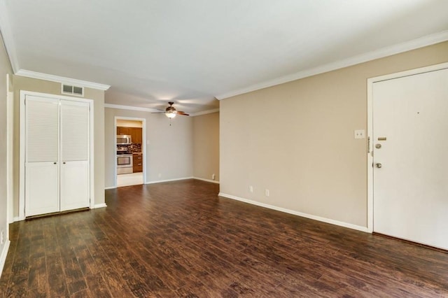 unfurnished living room featuring visible vents, ornamental molding, a ceiling fan, dark wood-style floors, and baseboards