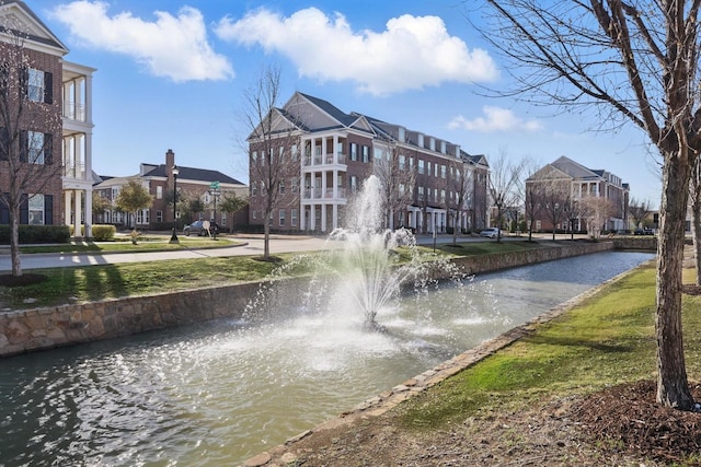 surrounding community with a water view