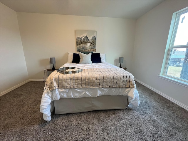 bedroom with carpet flooring and baseboards