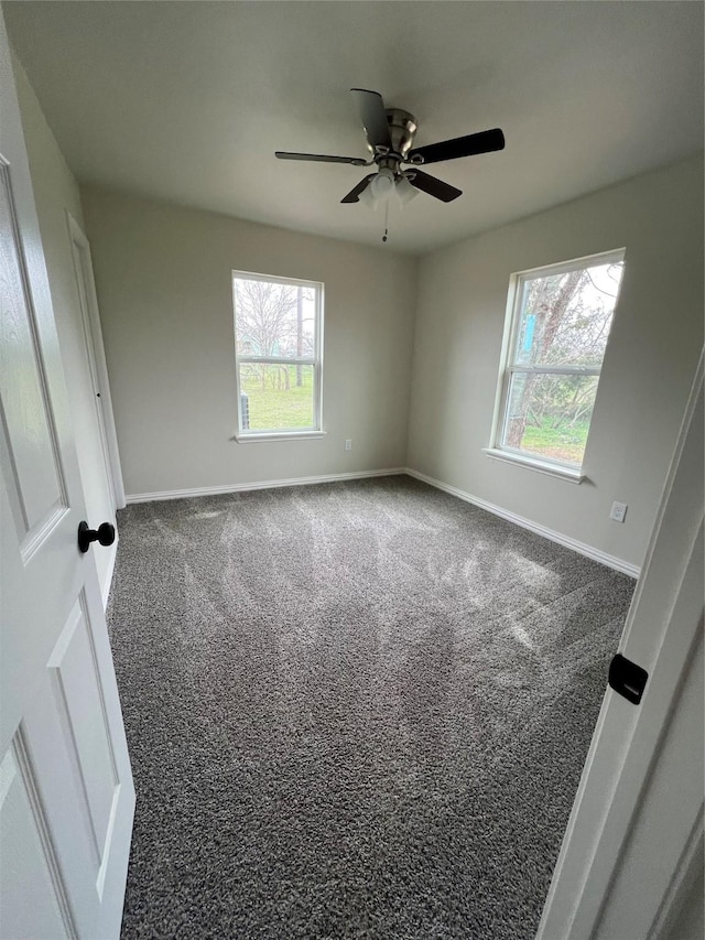 unfurnished bedroom featuring a ceiling fan, baseboards, and carpet floors