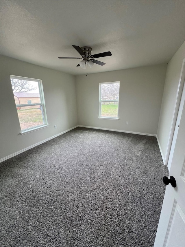 unfurnished bedroom featuring carpet flooring, baseboards, and ceiling fan