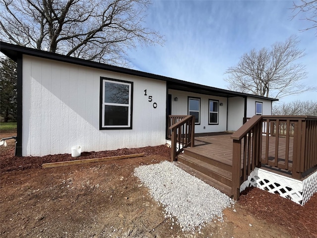 ranch-style home featuring a deck