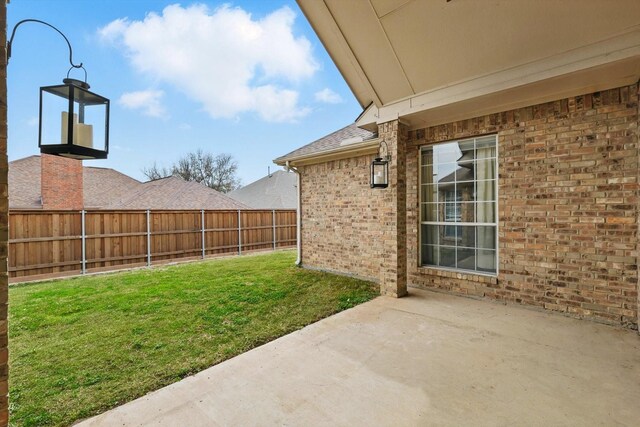 view of yard featuring a patio area and fence