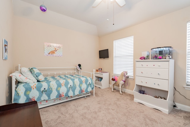 bedroom with baseboards, a ceiling fan, lofted ceiling, and carpet