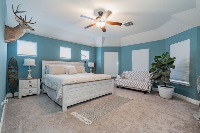 bedroom featuring visible vents, carpet floors, baseboards, and ceiling fan