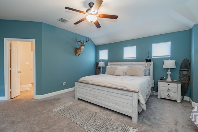 bedroom with visible vents, ceiling fan, baseboards, carpet, and lofted ceiling