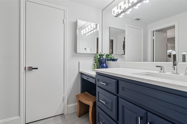 bathroom with visible vents and vanity