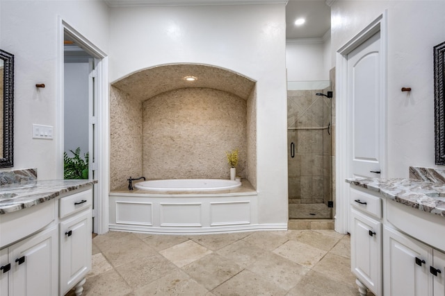 full bath featuring recessed lighting, two vanities, a bath, and a shower stall