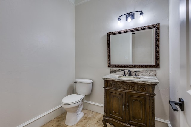 bathroom featuring tile patterned floors, baseboards, toilet, and vanity