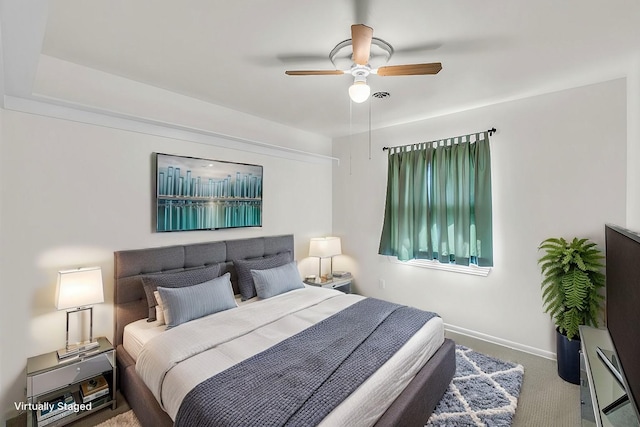 bedroom with baseboards, a ceiling fan, and carpet flooring