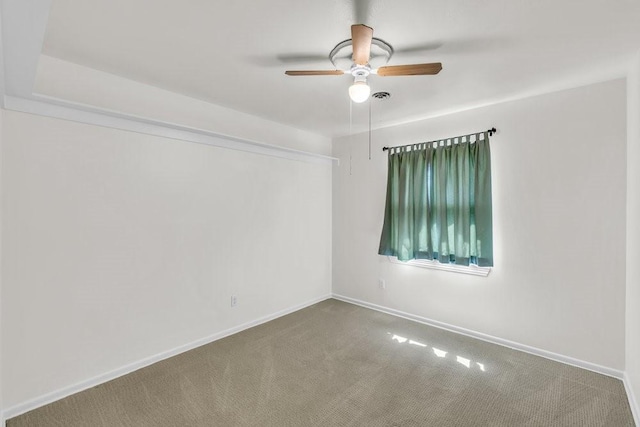 empty room with baseboards, carpet, and a ceiling fan