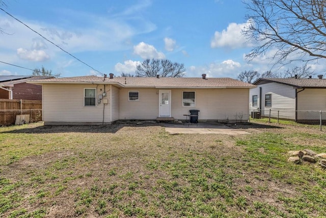 rear view of house with a patio area, central AC unit, a lawn, and a fenced backyard