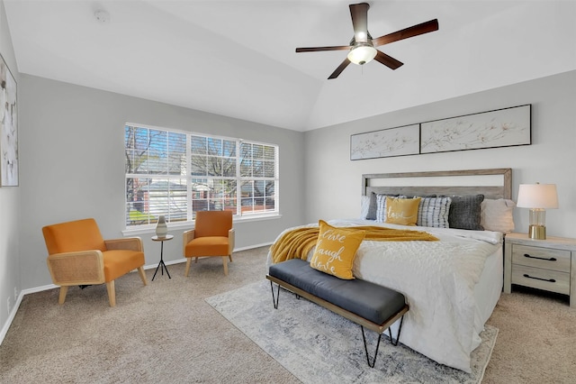 bedroom featuring baseboards, light carpet, ceiling fan, and vaulted ceiling