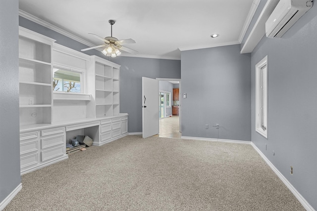 unfurnished living room with ornamental molding, a ceiling fan, a wall mounted AC, baseboards, and light colored carpet