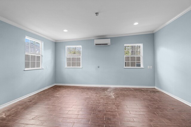 spare room with a healthy amount of sunlight, ornamental molding, wood tiled floor, and a wall unit AC