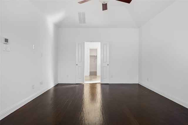 spare room with a ceiling fan, wood finished floors, visible vents, baseboards, and lofted ceiling