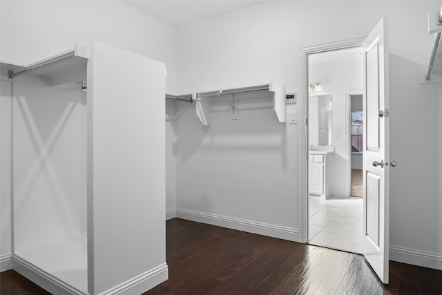 spacious closet featuring wood finished floors