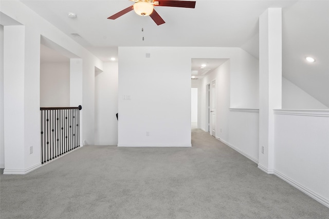 carpeted empty room featuring recessed lighting, baseboards, lofted ceiling, and a ceiling fan