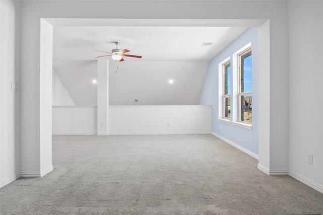 bonus room with carpet, visible vents, baseboards, lofted ceiling, and ceiling fan