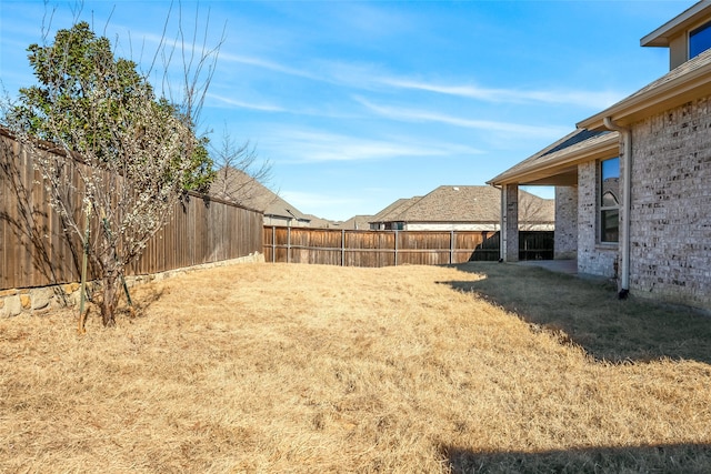 view of yard featuring a fenced backyard