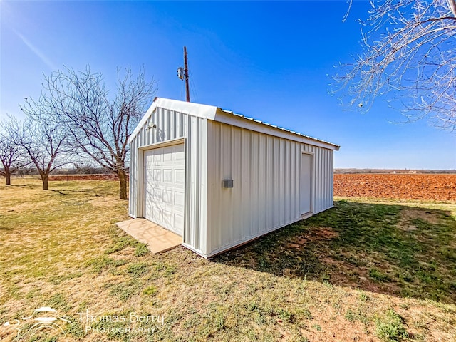 view of outbuilding featuring an outbuilding and driveway