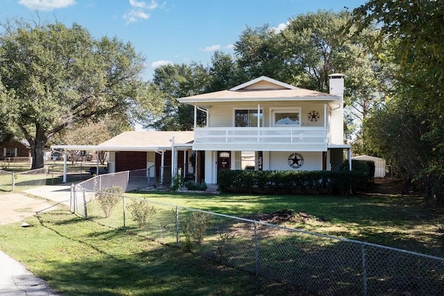 view of front of home featuring a front lawn, driveway, a fenced front yard, a balcony, and a carport