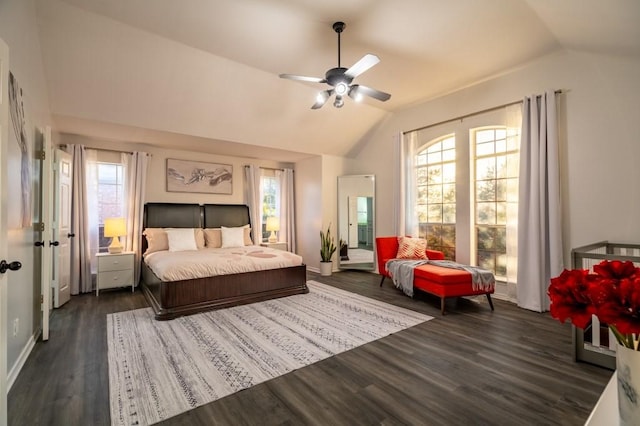 bedroom featuring baseboards, a ceiling fan, lofted ceiling, and wood finished floors