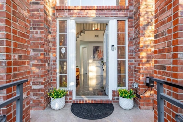 entrance to property with brick siding