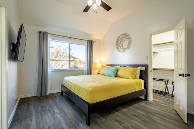 bedroom with vaulted ceiling, wood finished floors, baseboards, and ceiling fan