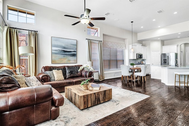 living room featuring recessed lighting, visible vents, dark wood-style floors, and ceiling fan