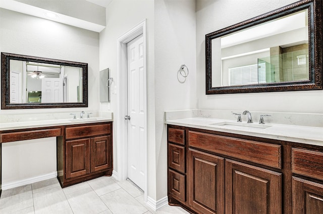 bathroom featuring tile patterned flooring, vanity, and a shower