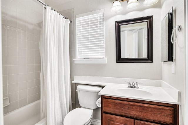 full bath with vanity, toilet, and shower / bath combo