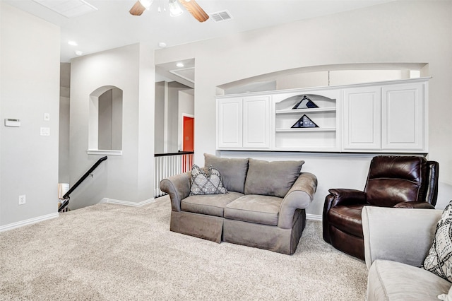 carpeted living area featuring a ceiling fan, recessed lighting, baseboards, and visible vents