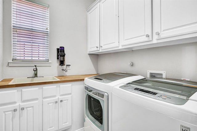 laundry room featuring a sink, cabinet space, and washing machine and clothes dryer